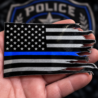 Black and silver flag badge with blue line